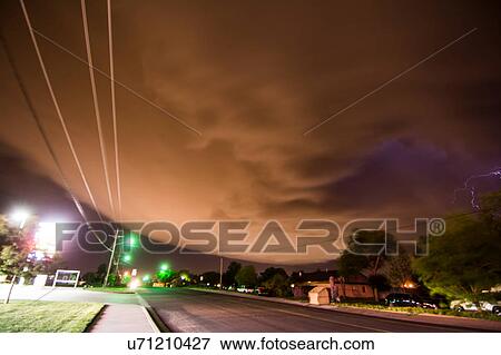 Stock Photo - A supercell storm cloud sparking with lightning sweeping over Amarillo, Texas. Fotosearch