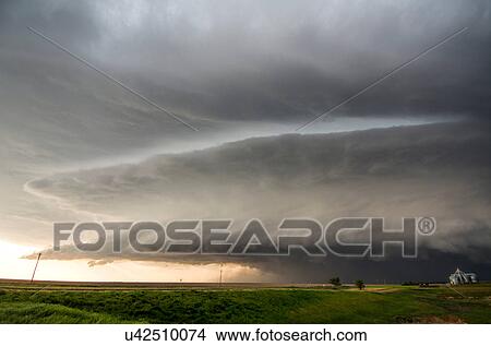 A tornado-producing supercell thunderstorm spinning over ranch land near Leoti, Kansas View Large Photo Image Picture - A tornado-producing supercell thunderstorm spinning over ranch land near Leoti, Kansas. Fotosearch