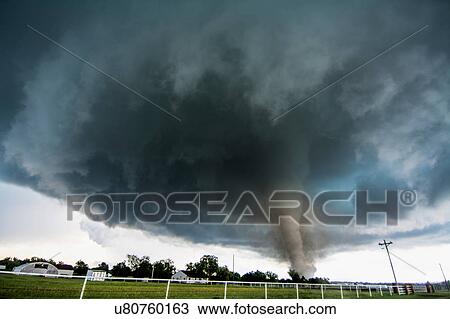 Stock Image - A tornado rated EF4 - with winds 166 to 175 miles per hour - striking a neighbourhood in Katie, Oklahoma. Fotosearch