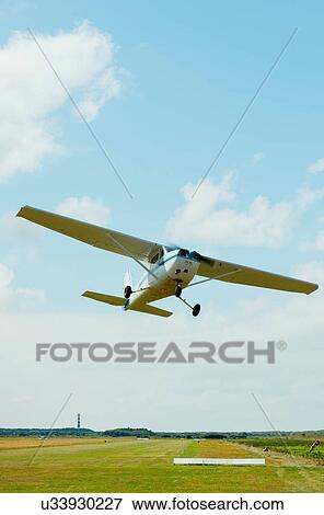 Stock Photo - Airplane taking off from airfield, Ballum, Friesland, Netherlands. Fotosearch