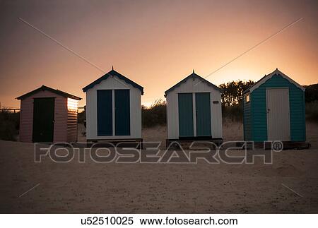 Stock Photography - Beach huts in a row at sunset, Southwold, Suffolk, UK. Fotosearch