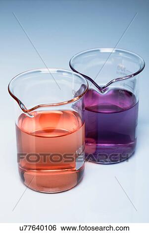 Stock Photograph - Beakers of acidic and basic solutions after litmus indicator has been added. Litmus changes its colour depending on the pH of the solution. Fotosearch