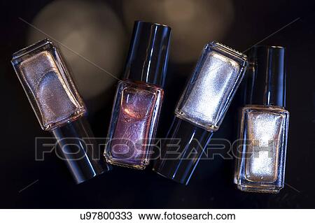 Bottles of nail polish against black background View Large Photo Image Stock Image - Bottles of nail polish against black background. Fotosearch