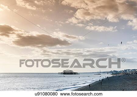 Brighton beach at dusk, England View Large Photo Image Stock Image - Brighton beach at dusk, England. Fotosearch
