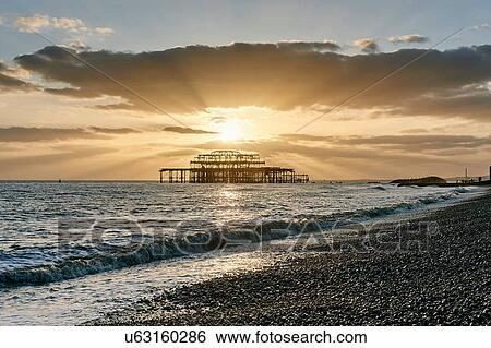 Brighton beach at sunset, England View Large Photo Image Stock Photograph - Brighton beach at sunset, England. Fotosearch