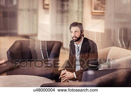 Picture - Businessman sitting in armchair. Fotosearch