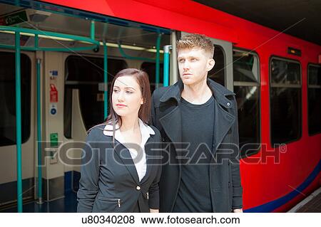 Businesswoman and businessman in Docklands Light Railway train, London View Large Photo Image Stock Photo - Businesswoman and businessman in Docklands Light Railway train, London. Fotosearch