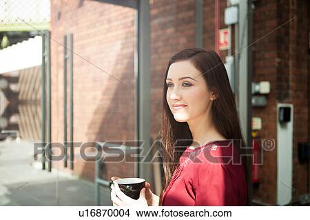 Businesswoman having coffee in cafe View Large Photo Image Picture - Businesswoman having coffee in cafe. Fotosearch