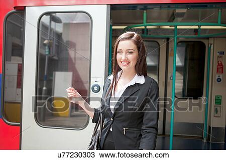 Businesswoman in Docklands Light Railway train, London View Large Photo Image Stock Image - Businesswoman in Docklands Light Railway train, London. Fotosearch