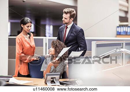 Businesswoman preparing paperwork at office desk View Large Photo Image Stock Photo - Businesswoman preparing paperwork at office desk. Fotosearch