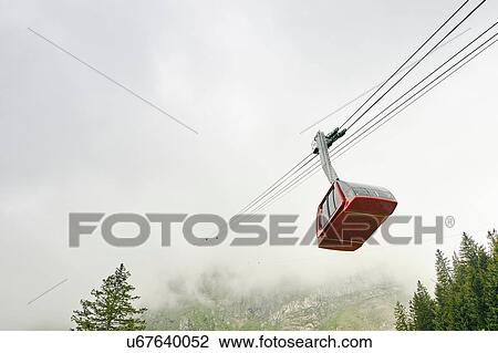 Stock Image - Cable car in mist, Mount Pilatus, Switzerland. Fotosearch