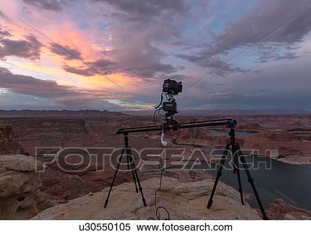 Camera on tripods photographing view of Lake Powell and canyons, Alstrom Point, Utah, USA View Large Photo Image Stock Photography - Camera on tripods photographing view of Lake Powell and canyons, Alstrom Point, Utah, USA. Fotosearch