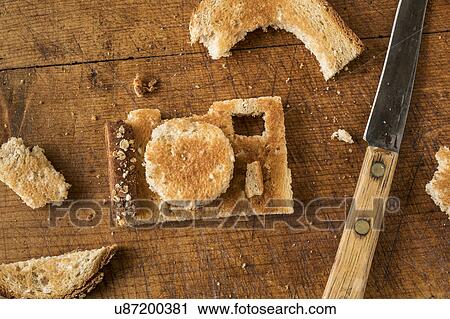 Stock Image - Camera shaped toast bread on cutting board. Fotosearch