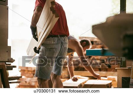 Carpenter working in workshop View Large Photo Image Stock Image - Carpenter working in workshop. Fotosearch