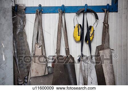 Carpenters' aprons in a row View Large Photo Image Stock Photo - Carpenters' aprons in a row. Fotosearch