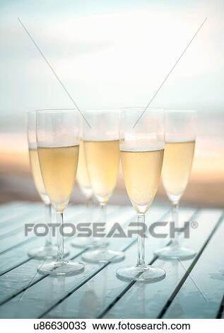 Champagne flutes of champagne View Large Photo Image Stock Image - Champagne flutes of champagne. Fotosearch