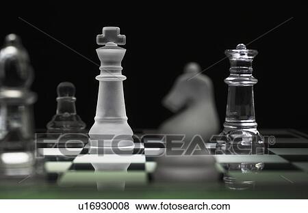 Stock Photo - Chess pieces on chess board. Fotosearch
