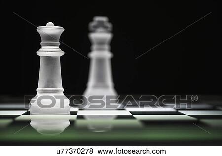 Chess queen and king on chess board View Large Photo Image Stock Photo - Chess queen and king on chess board. Fotosearch