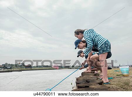 Children fishing on pier, Southwold, Suffolk, UK View Large Photo Image Stock Image - Children fishing on pier, Southwold, Suffolk, UK. Fotosearch