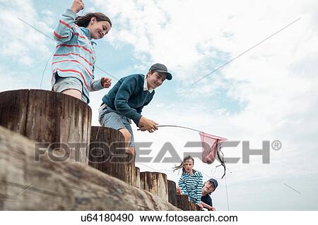 Children fishing on pier, Southwold, Suffolk, UK View Large Photo Image Stock Image - Children fishing on pier, Southwold, Suffolk, UK. Fotosearch