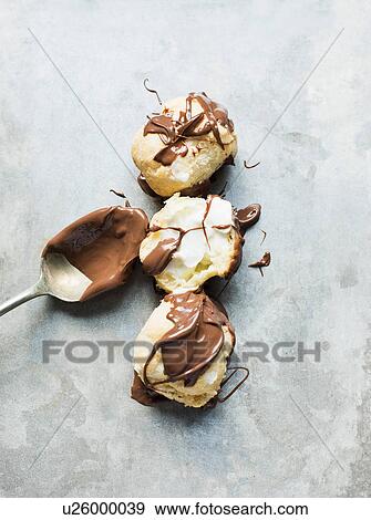 Chocolate covered profiteroles View Large Photo Image Stock Photo - Chocolate covered profiteroles. Fotosearch