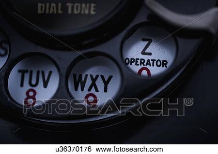 Close-up of telephone dial View Large Photo Image Stock Photograph - Close-up of telephone dial. Fotosearch