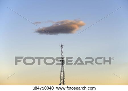 Cloud over communication tower at dusk View Large Photo Image Stock Image - Cloud over communication tower at dusk. Fotosearch