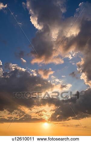 Clouds in sky at dusk View Large Photo Image Stock Image - Clouds in sky at dusk. Fotosearch