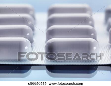 Stock Photography - Complete course of drugs in foil packaging. Fotosearch