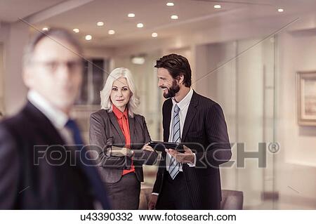 Confident businesswoman at meeting View Large Photo Image Stock Image - Confident businesswoman at meeting. Fotosearch