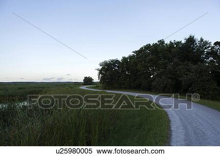 Stock Photography - Country road under clear sky. Fotosearch