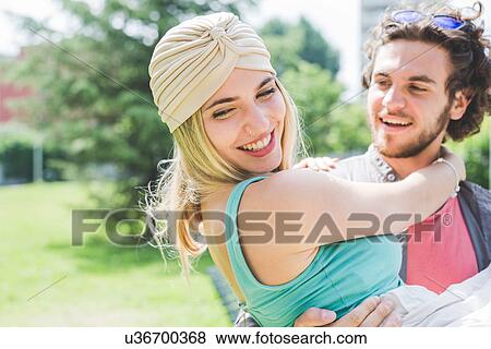 Couple hugging in park View Large Photo Image Stock Photo - Couple hugging in park. Fotosearch