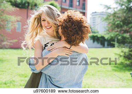 Couple hugging in park View Large Photo Image Stock Photo - Couple hugging in park. Fotosearch