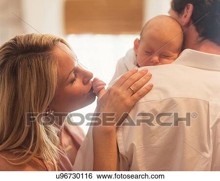 Couple with baby son (0-1 months) View Large Photo Image Stock Photograph - Couple with baby son (0-1 months). Fotosearch