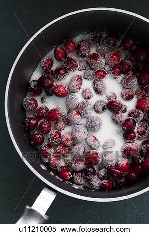 Stock Photography - Cranberries in pot. Fotosearch