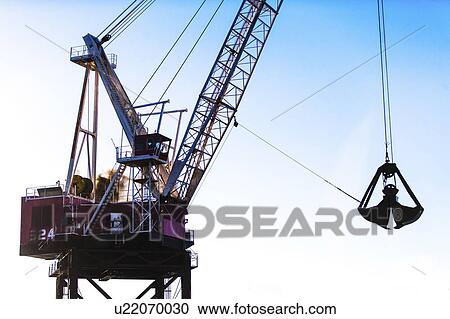 Crane against blue sky View Large Photo Image Stock Image - Crane against blue sky. Fotosearch