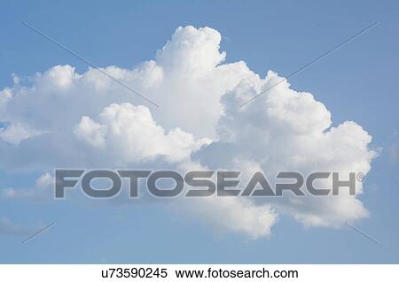 Stock Photography - Cumulus clouds against blue sky. Fotosearch