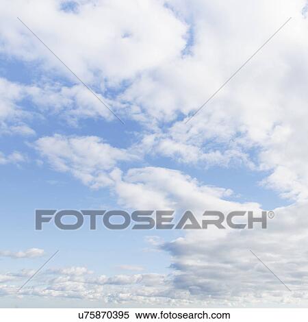 Stock Photography - Cumulus clouds in blue sky. Fotosearch