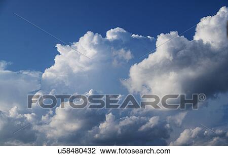 Stock Image - Cumulus clouds on sky. Fotosearch