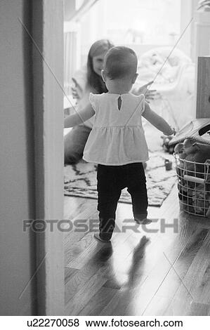 Daughter (18-23 months) walking towards mother View Large Photo Image Stock Photo - Daughter (18-23 months) walking towards mother. Fotosearch