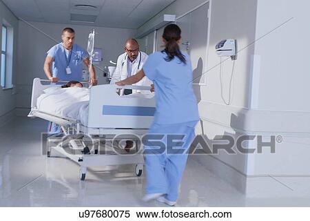 Doctor and medical running with patient bed in hospital emergency View Large Photo Image Stock Photography - Doctor and medical running with patient bed in hospital emergency. Fotosearch