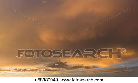 Stock Photo - Dramatic sunset sky. Fotosearch
