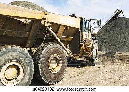 Dump truck in gravel quarry View Large Photo Image Stock Image - Dump truck in gravel quarry. Fotosearch