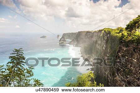 Elevated view of coastal cliffs, South Coast, Nusa Penida, Indonesia View Large Photo Image Stock Photo - Elevated view of coastal cliffs, South Coast, Nusa Penida, Indonesia. Fotosearch