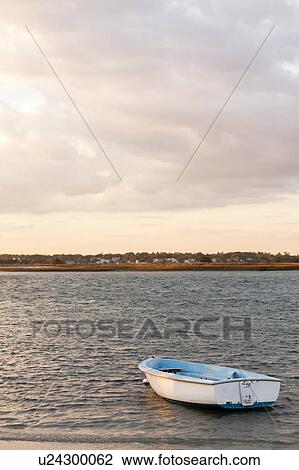Stock Image - Empty boat in water. Fotosearch