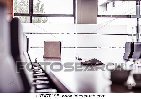 Stock Photography - Empty conference table with rows of chairs. Fotosearch
