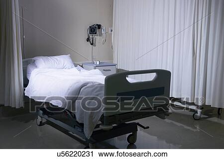 Stock Image - Empty unmade hospital bed in hospital ward. Fotosearch