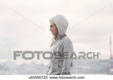 Female runner in grey hoody on misty dockside View Large Photo Image Stock Image - Female runner in grey hoody on misty dockside. Fotosearch