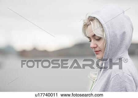 Female runner looking down on dockside View Large Photo Image Stock Image - Female runner looking down on dockside. Fotosearch
