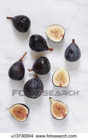 Picture - Figs lying on marble table. Fotosearch